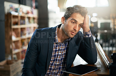 Buy stock photo Stress, upset and businessman with a tablet in the office while working on a corporate project. Technology, migraine and professional male employee with a digital mobile for a report in the workplace
