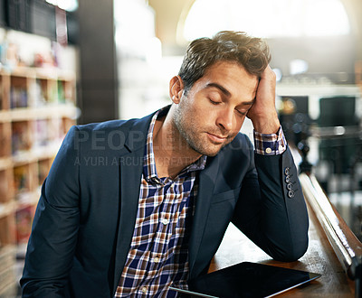 Buy stock photo Stress, burnout and businessman with a digital tablet in the library while working on a corporate project. Technology, tired and professional male employee with a mobile for a report in the workplace