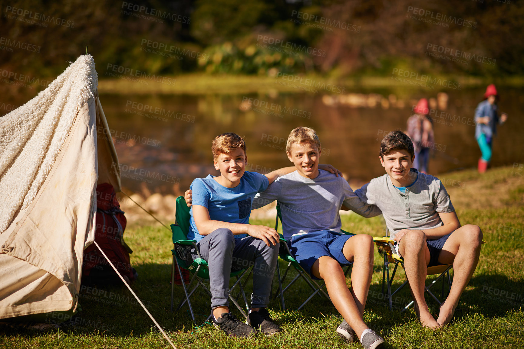 Buy stock photo Camping, adventure and kids with tent and happiness for outdoor activity, friends on vacation in park. Children, boys and portrait with smile for holiday, freedom with travel to relax in Europe