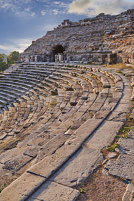 Buy stock photo Turkey, stone and theater in ruins for architecture, archeology and travel to ancient city. History, steps and rock in abandoned Greek amphitheater for exploration, culture or anthropology in Miletus