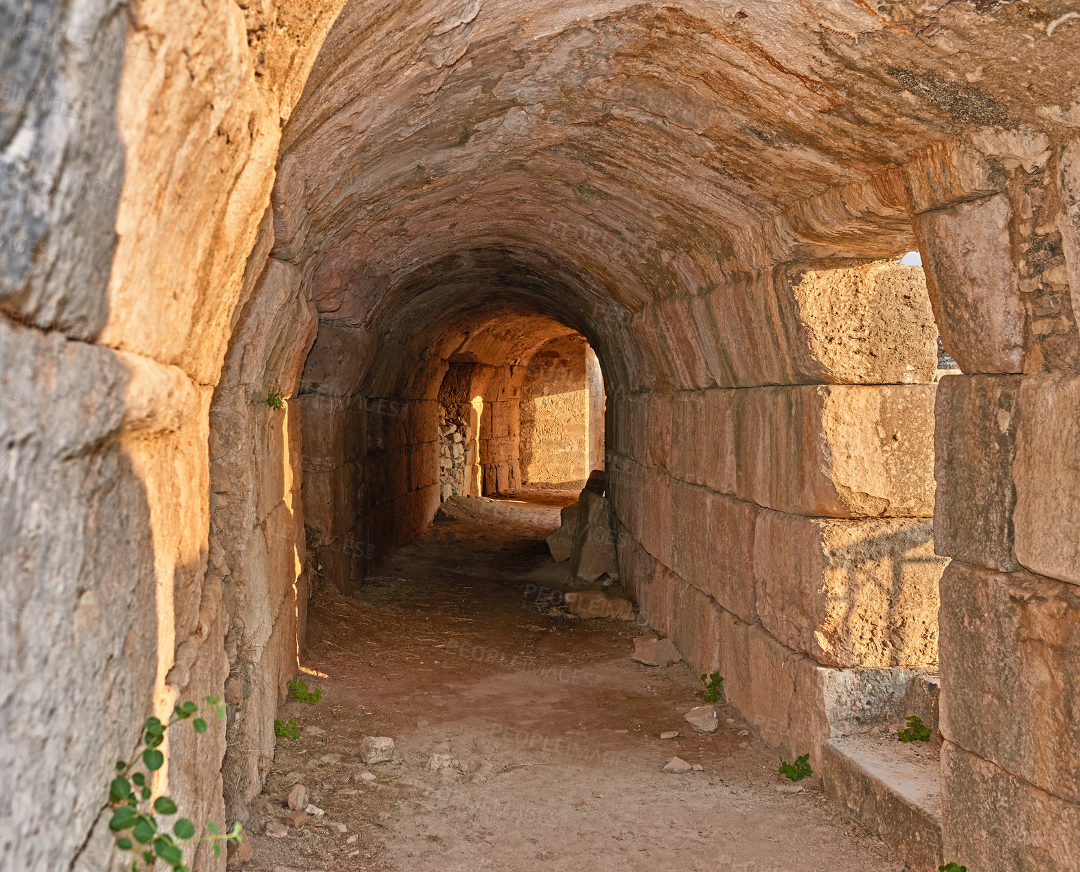 Buy stock photo Ancient, stone and tunnel in ruins for architecture, archeology and travel to city in Turkey. History, rock and passage in abandoned Greek theater for exploration, culture and anthropology in Miletus