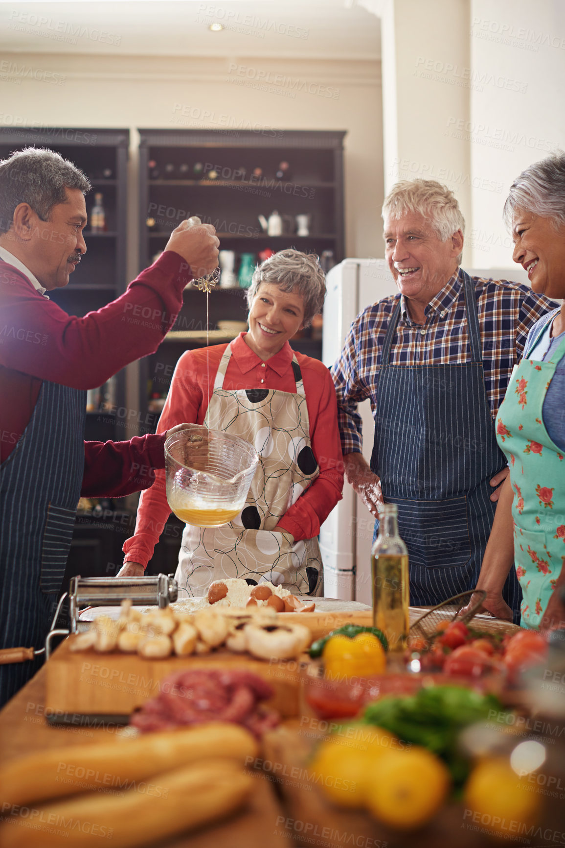 Buy stock photo Cooking, food and senior friends in the kitchen of a home for a dinner party or social celebration event. Diversity, retirement or community with a group of men and women in a house to prepare a meal