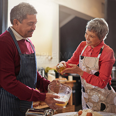 Buy stock photo Food, love and senior couple cooking in kitchen for fun, bonding or meal prep, care or help in a house. Diet, nutrition and happy old people with olive oil, support or assistance for  home recipe