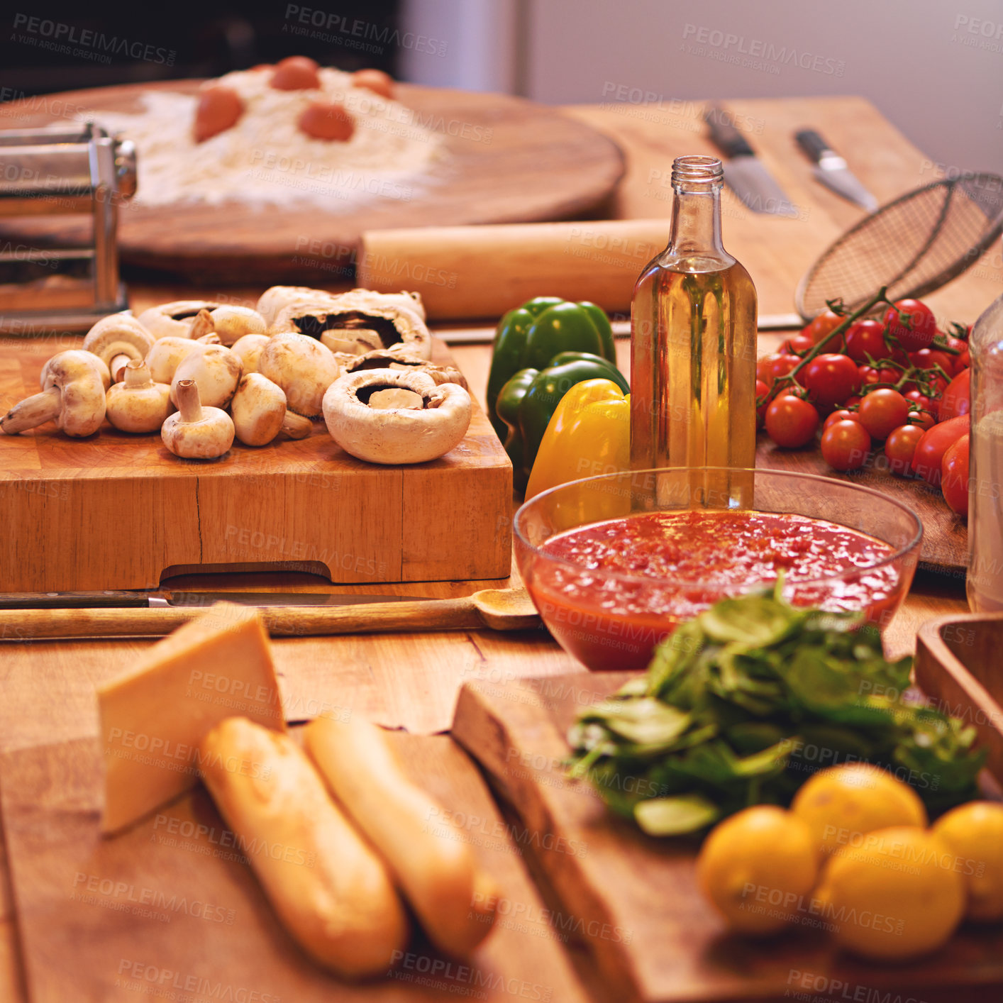 Buy stock photo Cooking, pasta and vegetables in kitchen on table for meal prep for dinner, supper and lunch in home. Recipe, food and utensils on counter with ingredients for wellness, nutrition and healthy eating