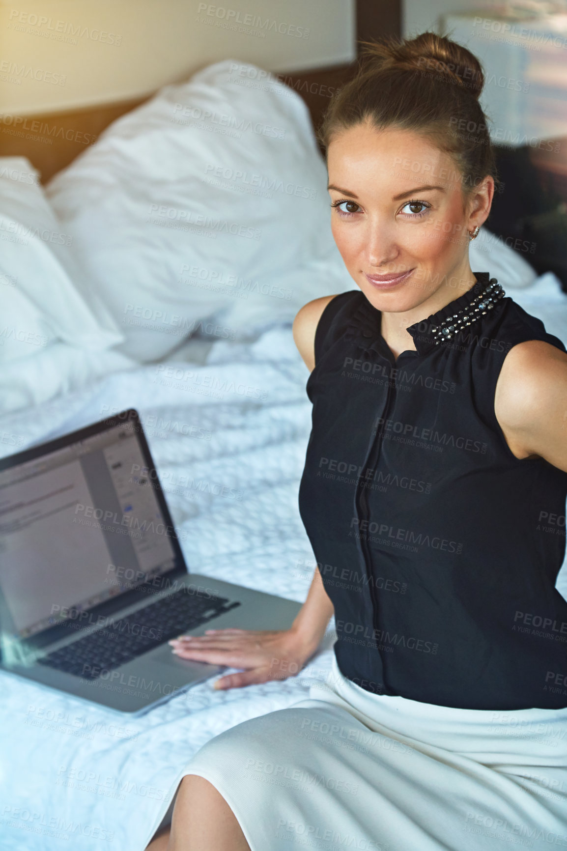 Buy stock photo Portrait, woman and business trip in hotel room with laptop for remote work, project management or pride. Female person, smile and planning in accommodation with computer, internet or travel for job.