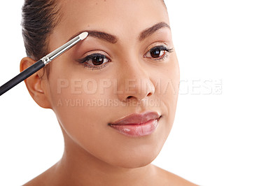 Buy stock photo Happy woman, beauty and makeup with brush for eyebrows, cosmetics or cosmetology on a white studio background. Face of young female person or model in facial treatment or applying volume and shadow