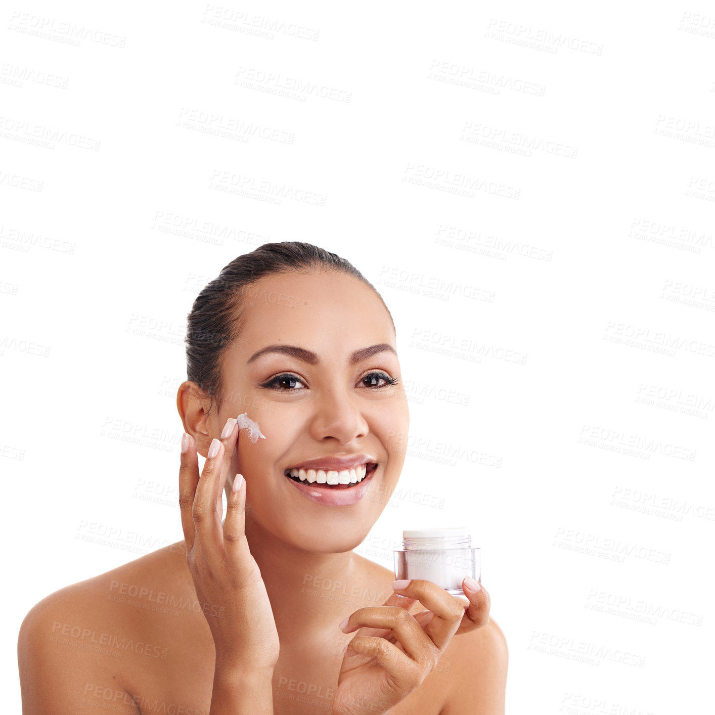 Buy stock photo Studio shot of a beautiful young woman applying moisturizer to her skin