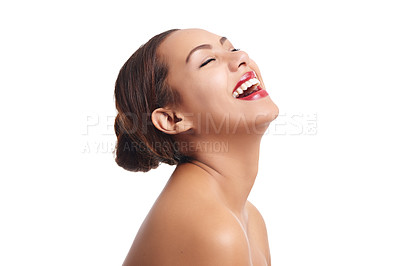 Buy stock photo Studio shot of a beautiful young woman laughing against a white background