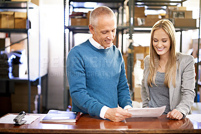 Buy stock photo Discussion, smile and factory team with document for shipping or storage with mature manager reading report. Warehouse, paperwork and logistics for inventory, distribution or business people planning