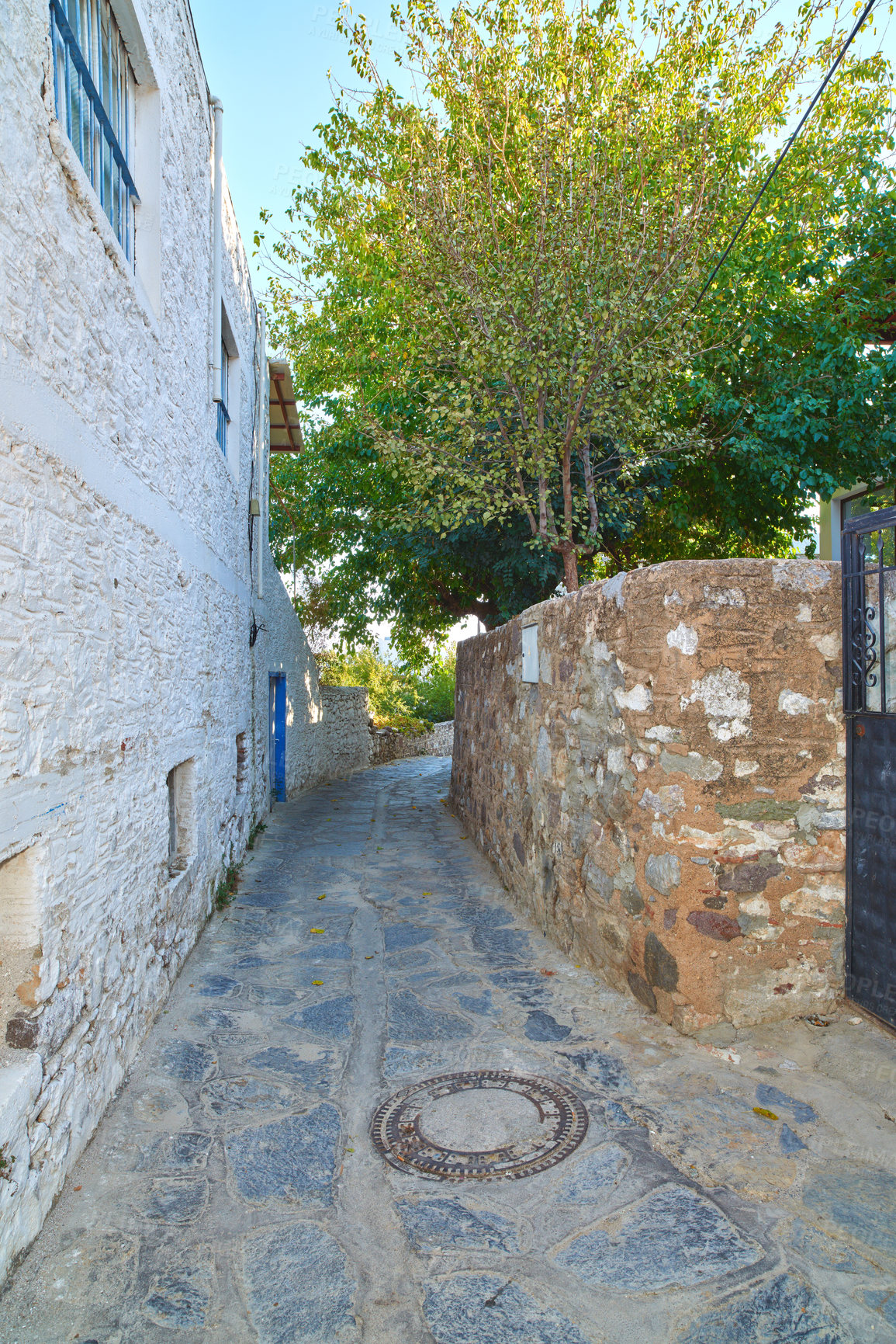 Buy stock photo Road, tiles or path at houses for architecture, buildings or travel or exploration in Turkey. Bodrum, city or cobblestone in day for heritage, history or village design in Europe for aesthetic