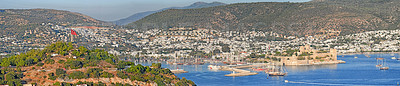 Buy stock photo Panorama view of city and hills in romantic harbor of Bodrum in Turkey during the day. Scenic landscape view of sailing yachts in cruise port and bay. Tourism abroad, overseas in Aegean sea dockyard