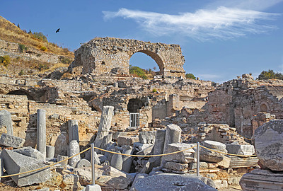 Buy stock photo Ancient city ruins of Ephesus in Turkey during the day. Traveling abroad and overseas for holiday, vacation, tourism. Excavated remains of historical building stone from Turkish history and culture