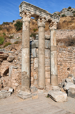 Buy stock photo Historical Turkey pillars Ephesus in an ancient city. Excavated remains of historical building stone in Turkish history and culture. Ruin of ancient roman architecture in a popular tourism attraction