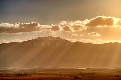 Buy stock photo Sunshine, clouds and mountain with rays on farmland of natural environment for season, change or weather. Empty space, sky and nature with sunrise for autumn morning, landscape or farm in countryside