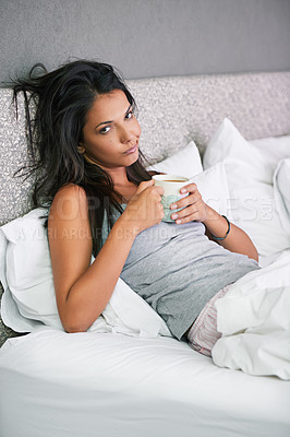 Buy stock photo Woman, portrait and tired with coffee in bed for early morning in apartment with exhausted, caffeine or house. Female person, face and mug for latte beverage on Monday or unhappy, moody or insomnia
