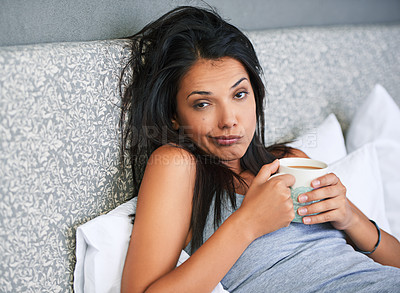 Buy stock photo Woman, portrait and tired or drinking coffee in bedroom for early morning in apartment or exhausted, caffeine or house. Female person, face and latte beverage on Monday for unhappy, moody or insomnia