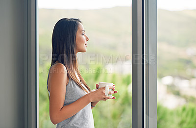Buy stock photo Window, view and woman with a coffee, morning and thinking at home, relax and ideas. Female person, model and happy girl with tea, glass and lady with wellness, thoughts and start day in an apartment