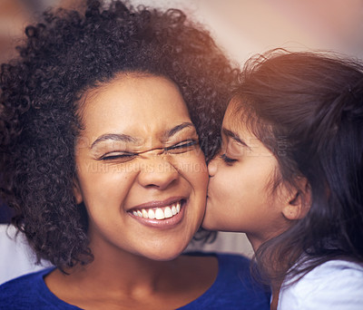 Buy stock photo Cropped shot of a little girl kissing her mother on the cheek