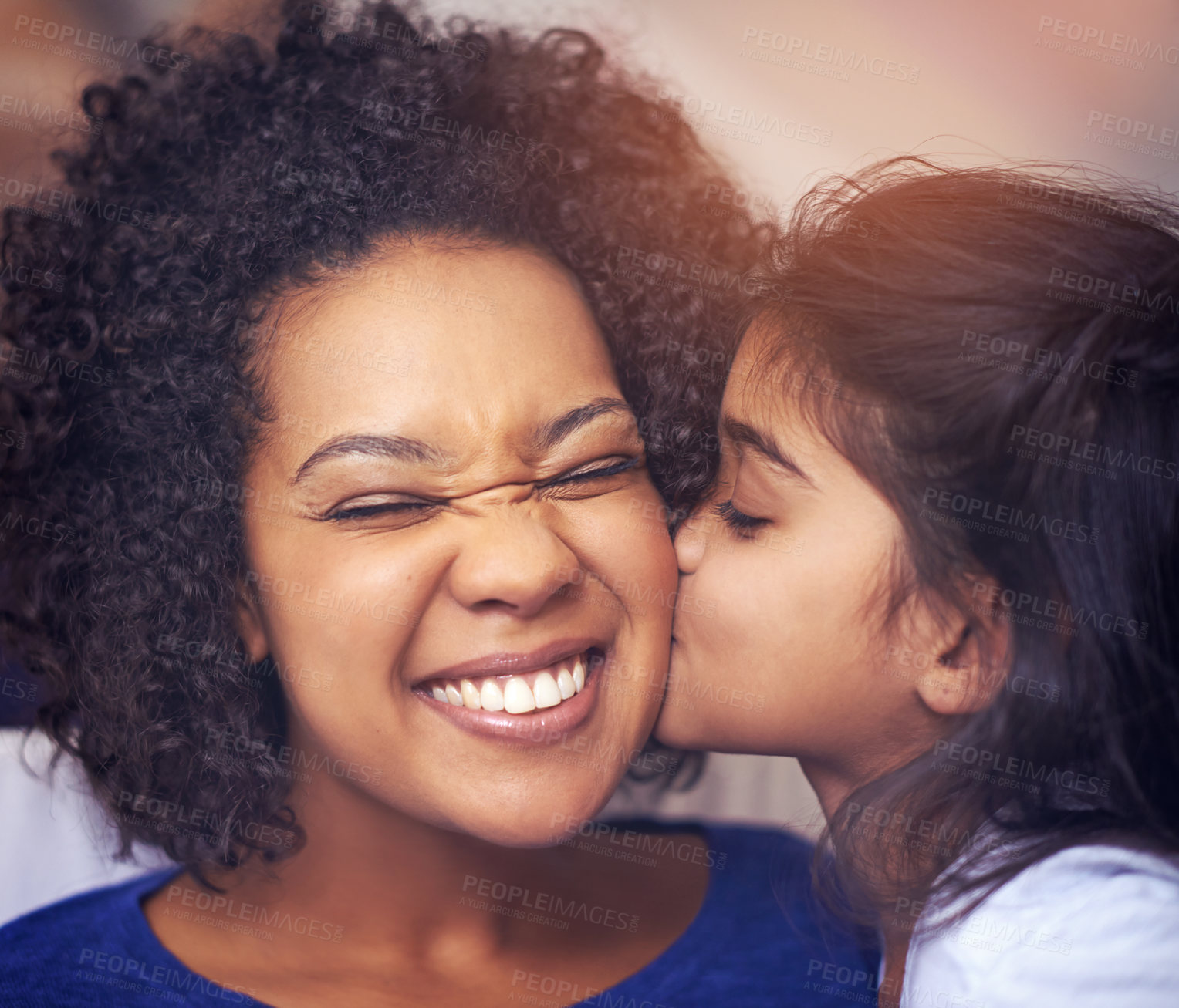 Buy stock photo Cropped shot of a little girl kissing her mother on the cheek