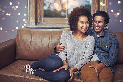 Buy stock photo Portrait, love and happy couple relax on a sofa, romantic and bonding on date night with bokeh. Interracial relationship, face and man embrace woman on a couch, smile and chilling in a living room
