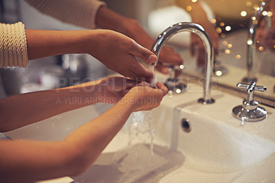 Buy stock photo Water, closeup and washing hands by mother and child in a bathroom for learning, hygiene and care. Basin, home and hand cleaning by mom and girl together for prevention of bacteria, dirt and germs