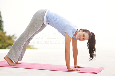 Buy stock photo Full length portrait of a young woman doing yoga outdoors