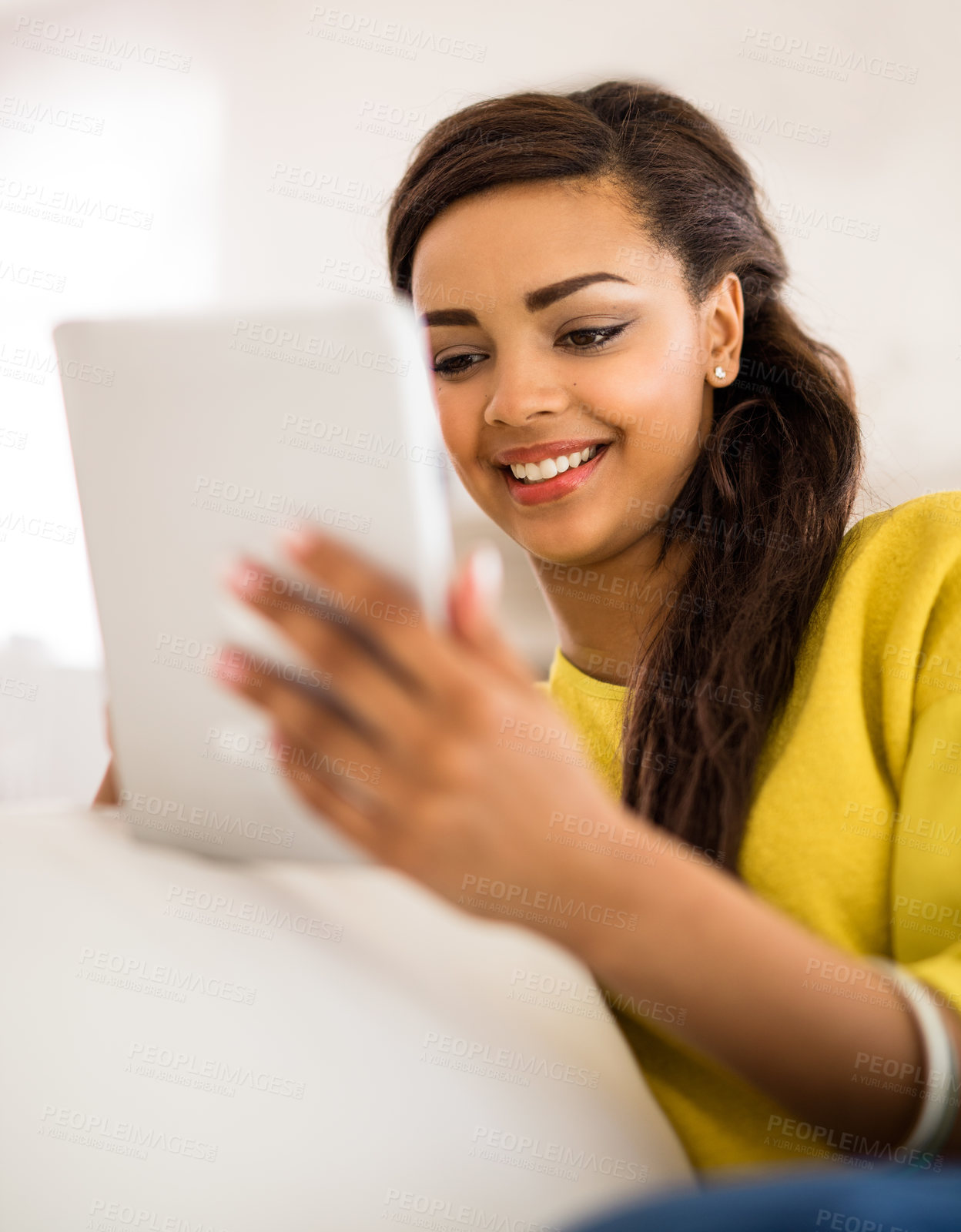 Buy stock photo Smile, reading and woman on sofa with tablet in living room for ebook, story or newsletter subscription. Online, technology and gen z person for streaming, social media or scroll internet in home