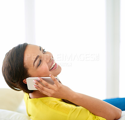 Buy stock photo Woman, phonecall and laugh for audio conversation, funny joke and good news on sofa in lounge. Young person, happy and mobile phone for comic talk, chatting or speaking for discussion on mockup