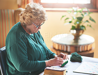 Buy stock photo Cropped shot of seniors playing a boardgame