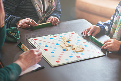 Buy stock photo Cropped shot of seniors playing a boardgame