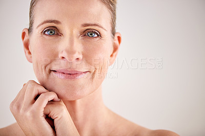 Buy stock photo Cropped studio portrait of an attractive mature woman