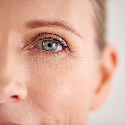 Buy stock photo Closeup shot of an attractive mature woman with the focus on her eyes