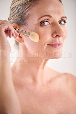 Buy stock photo Brush, cosmetic and portrait of woman in studio for makeup, self care and facial glow routine. Beauty, foundation and mature female person with cosmetology tool for face treatment by white background
