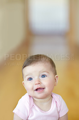 Buy stock photo Portrait of an adorable baby girl sitting on the living room floor