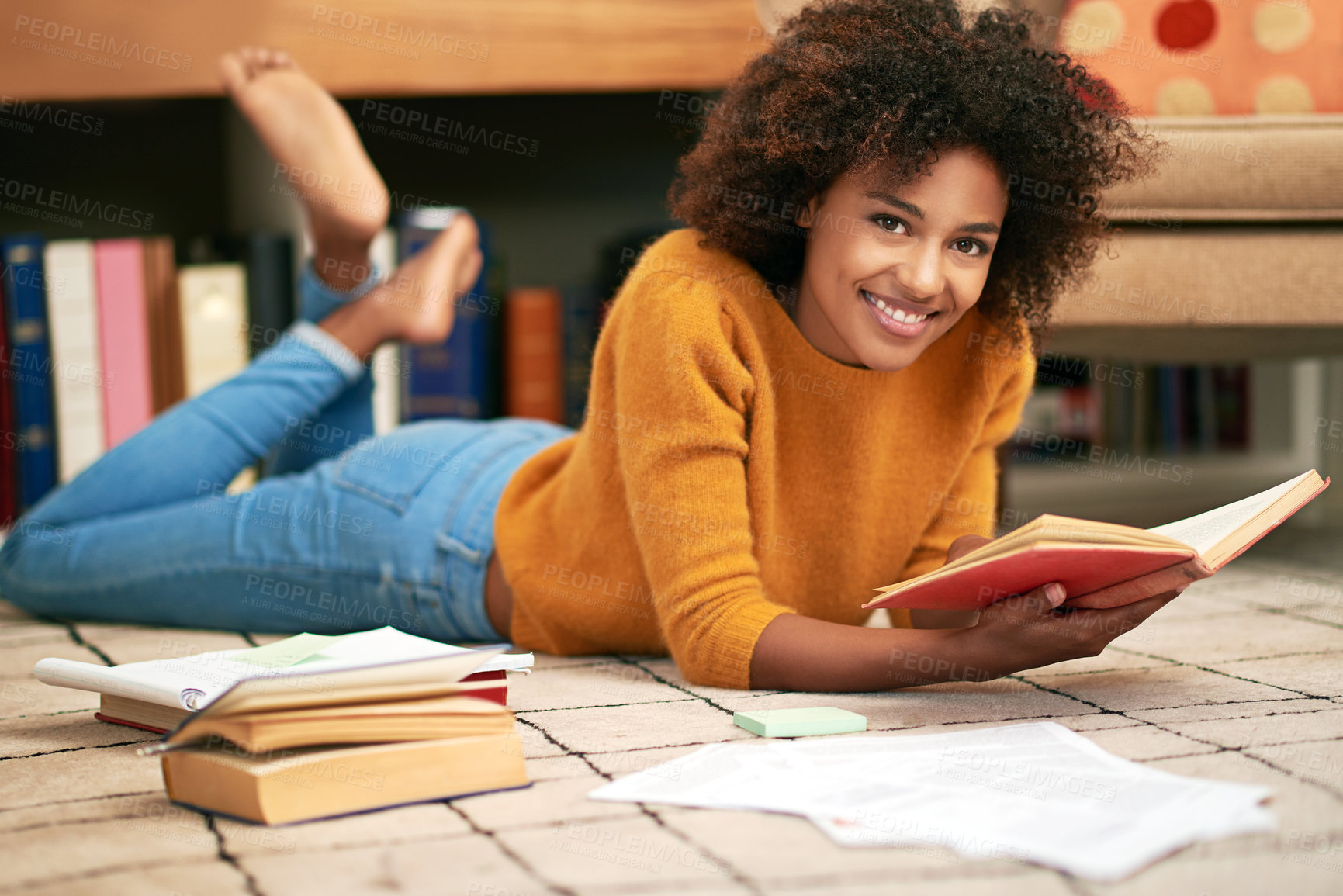 Buy stock photo African woman, books and portrait on floor in library for  learning, relax and self study for education. Female student, smile and unwind with novel or notes for literature or academic knowledge     