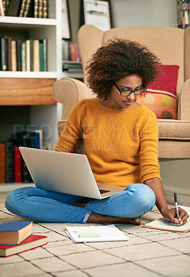 Buy stock photo Laptop, books and African woman in library, floor and writing notes for education. Study, learning and female student with natural afro hair, assignment or technology for knowledge and reading
