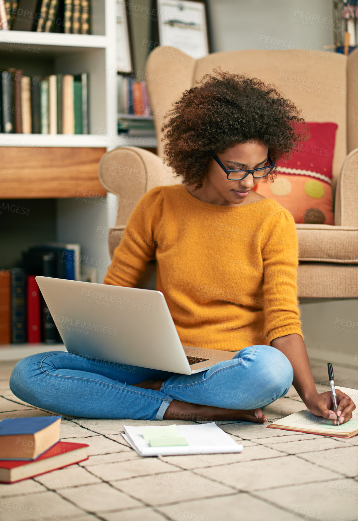 Buy stock photo Laptop, books and African woman in library, floor and writing notes for education. Study, learning and female student with natural afro hair, assignment or technology for knowledge and reading