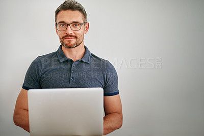 Buy stock photo Businessman, portrait  and smile in studio with laptop, relax and confidence of employee or staff. Creative, designer and male person, startup and worker with pride, company and model in job
