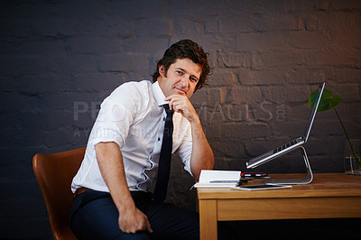 Buy stock photo Portrait of a businessman working late at the office