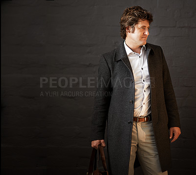 Buy stock photo Serious, business and man for fashion in studio with professional clothing, stylish and designer bag as detective.  Thinking, male person and idea of vintage suit or investigation on black background