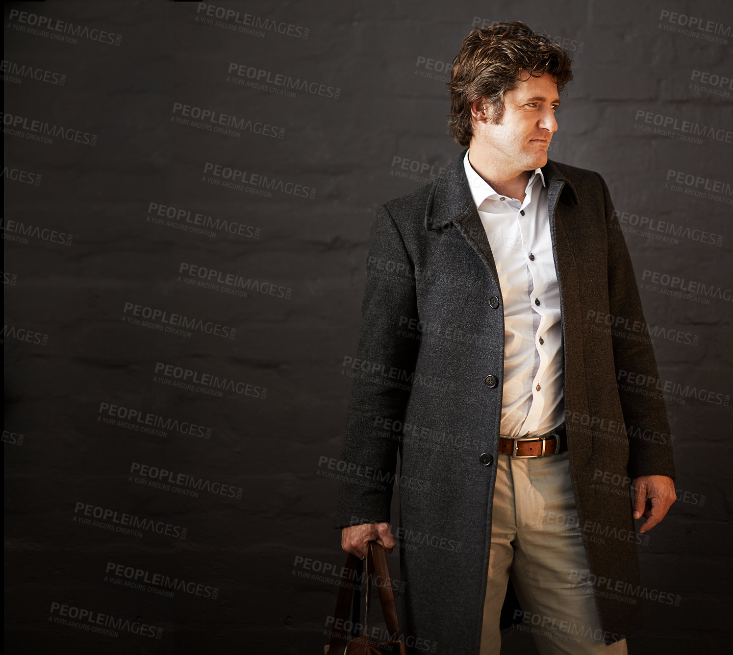 Buy stock photo Serious, business and man for fashion in studio with professional clothing, stylish and designer bag as detective.  Thinking, male person and idea of vintage suit or investigation on black background