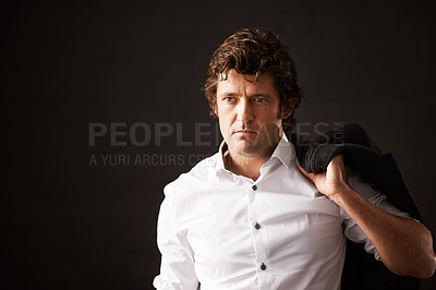 Buy stock photo Serious, businessman and jacket on shoulder in studio with confidence as detective of power, ambition and mystery. Pensive, male person and officer, pride and crime investigation on black background