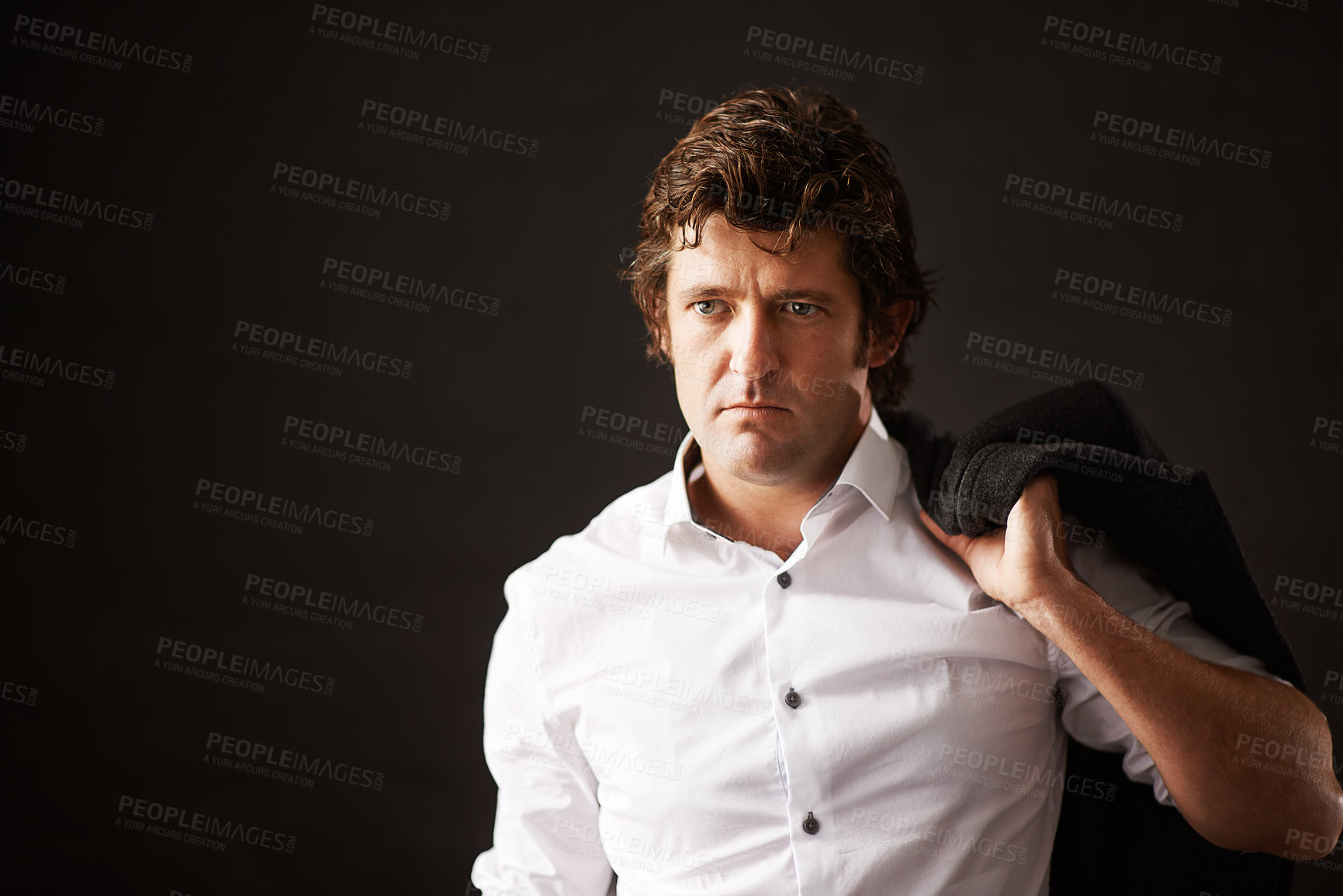 Buy stock photo Serious, businessman and jacket on shoulder in studio with confidence as detective of power, ambition and mystery. Pensive, male person and officer, pride and crime investigation on black background