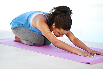 Buy stock photo Woman, stretching and health on mat with yoga for holistic fitness, flexibility and spiritual wellness in studio. Yogi, person and meditation for pilates with balasana, kneeling and mindfulness club