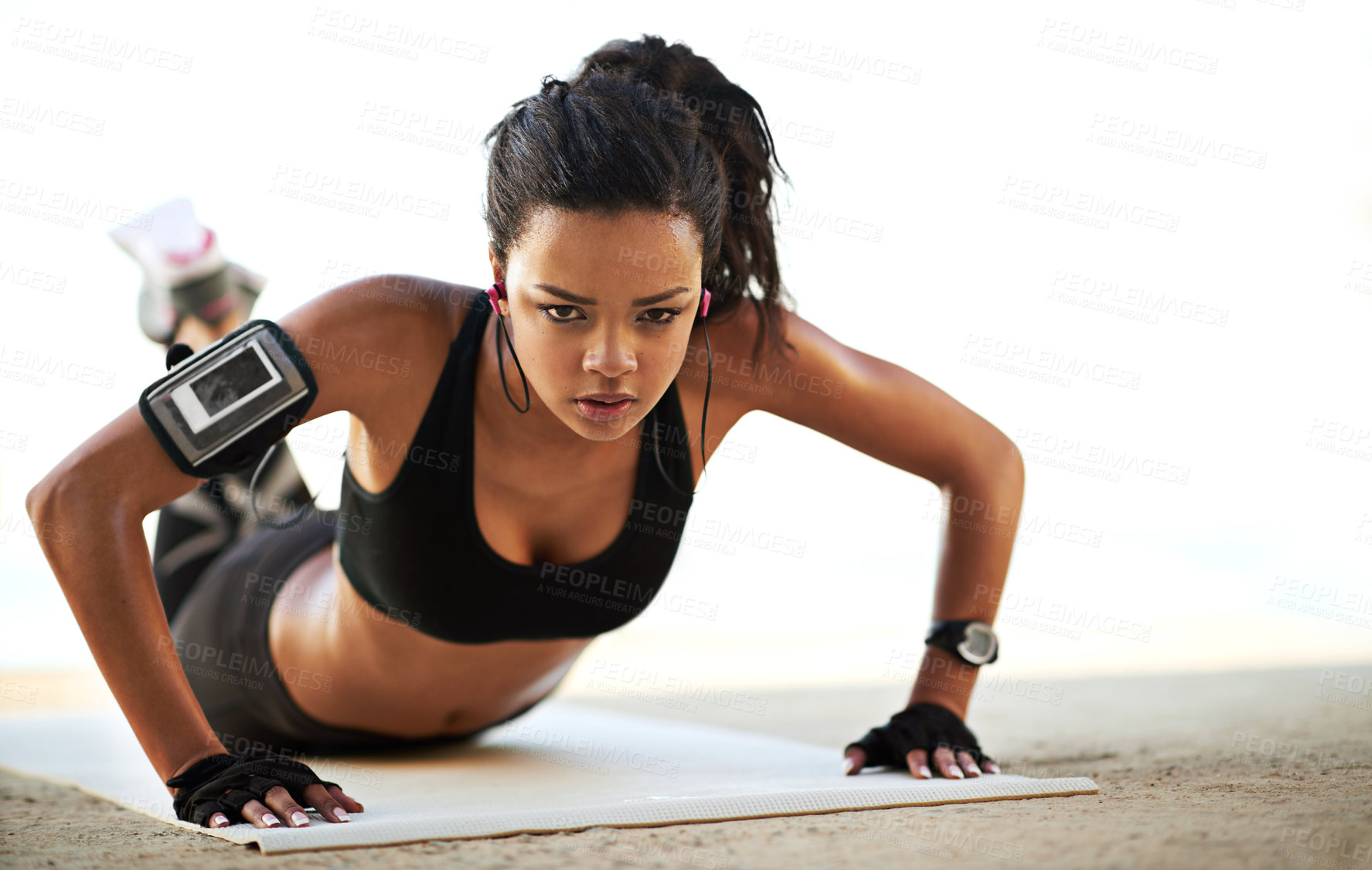 Buy stock photo Woman, portrait and fitness with push ups or earphones for workout, exercise or outdoor training on mat. Active female person lifting body weight on floor with music for muscle gain or strength