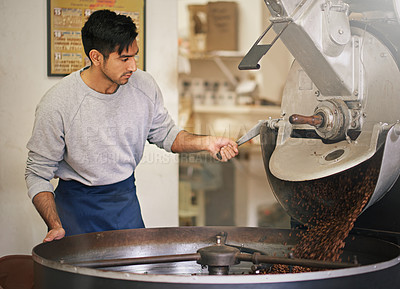 Buy stock photo Coffee beans, small business and man with machine for roasting with blending, production and quality control. Entrepreneur, barista or roaster at cafe, sustainable startup shop and espresso process
