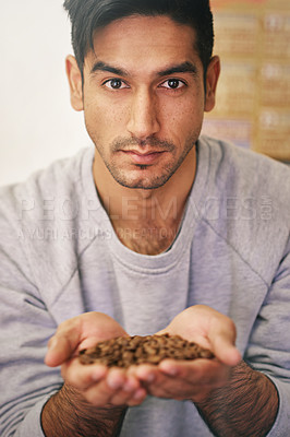 Buy stock photo Man, holding coffee grain and manufacturing with pride for premium organic beans at warehouse. Person, employee and production for export, industry and factory with quality assurance in Colombia