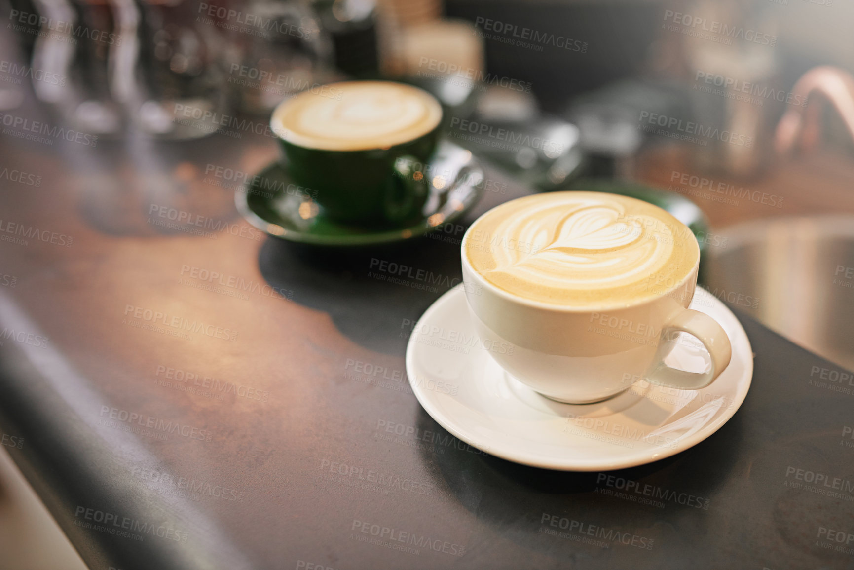 Buy stock photo Coffee on counter, cup and latte with art for creativity, cappuccino or caffeine drink with pattern. Warm beverage on table, foam and milk with heart or leaf design, hospitality and service at cafe