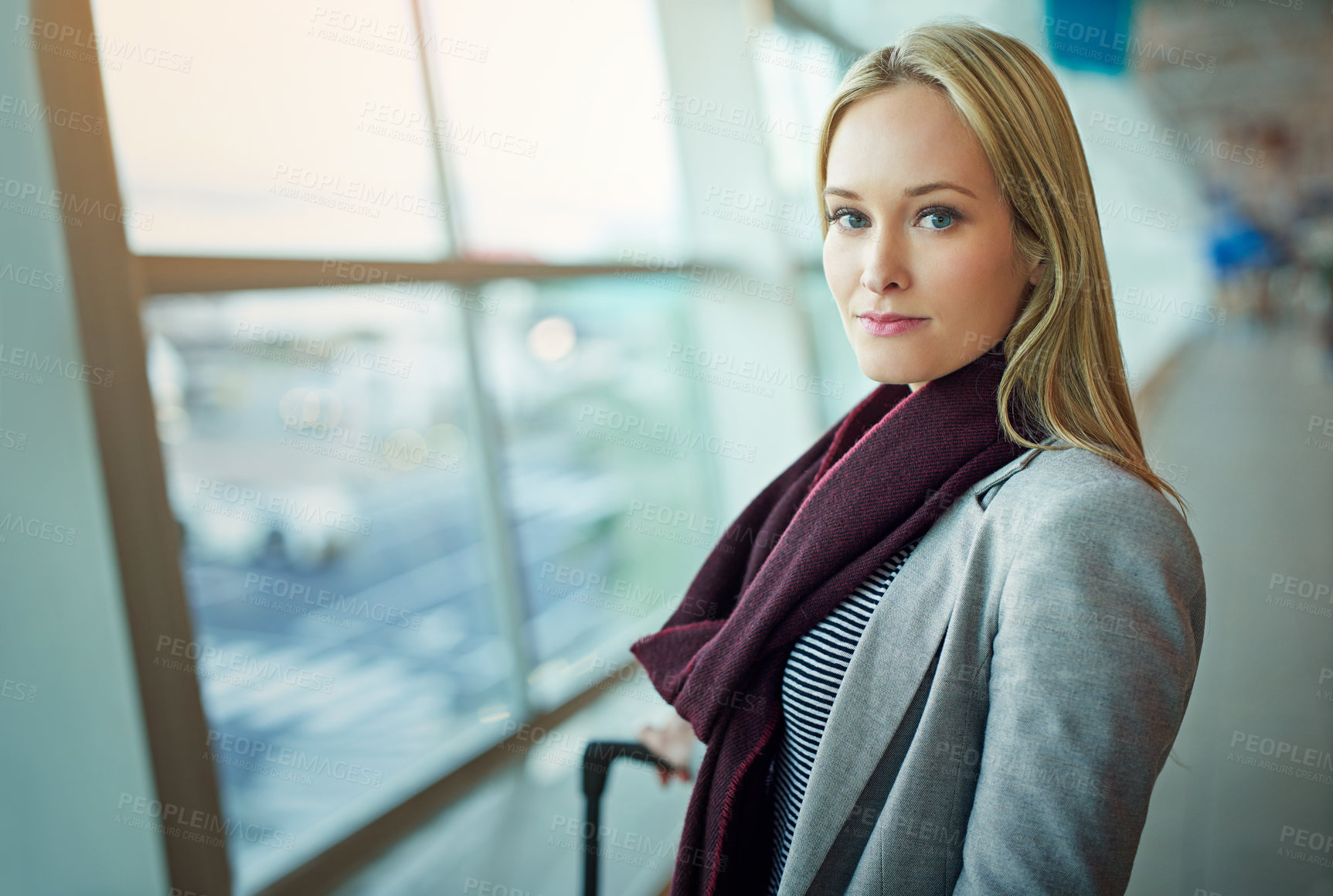 Buy stock photo Portrait of a young woman standing in an airport