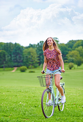 Buy stock photo Happy, freedom and woman on bicycle in countryside for wellness and sustainable transportation. Earth, female person and smile for blue sky, summer and adventure or cycling with clean energy in park